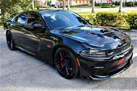 Dodge charger scat pack used - The 2021 Dodge Charger recalls the days when most full-size sedans had rear-wheel drive and rumbly V-8 engines. ... where the 485-hp Charger R/T Scat Pack posted an impressive 3.8-second sprint to ...